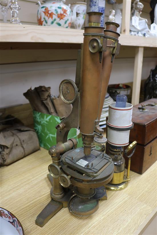 A Smith & Beck brass microscope, a bulls-eye condenser oil lamp, and a R & J Beck microscope microscope length 39cm